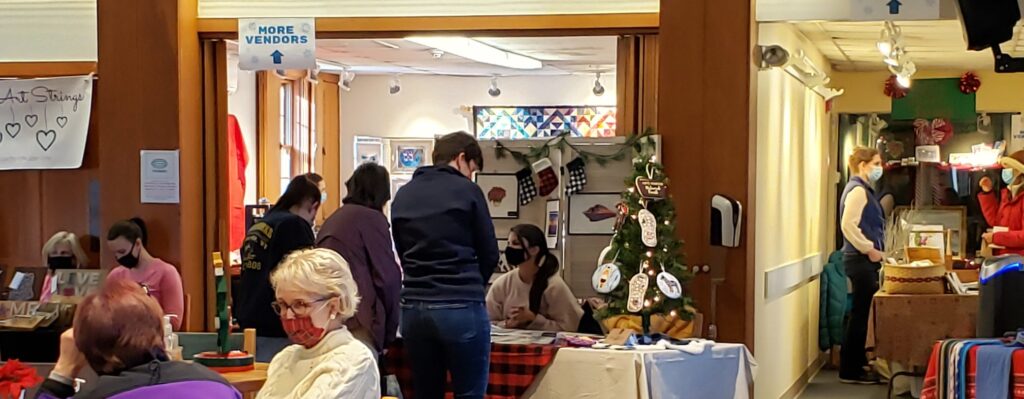 Customers browse items at the 2021 Holiday Craft Fair